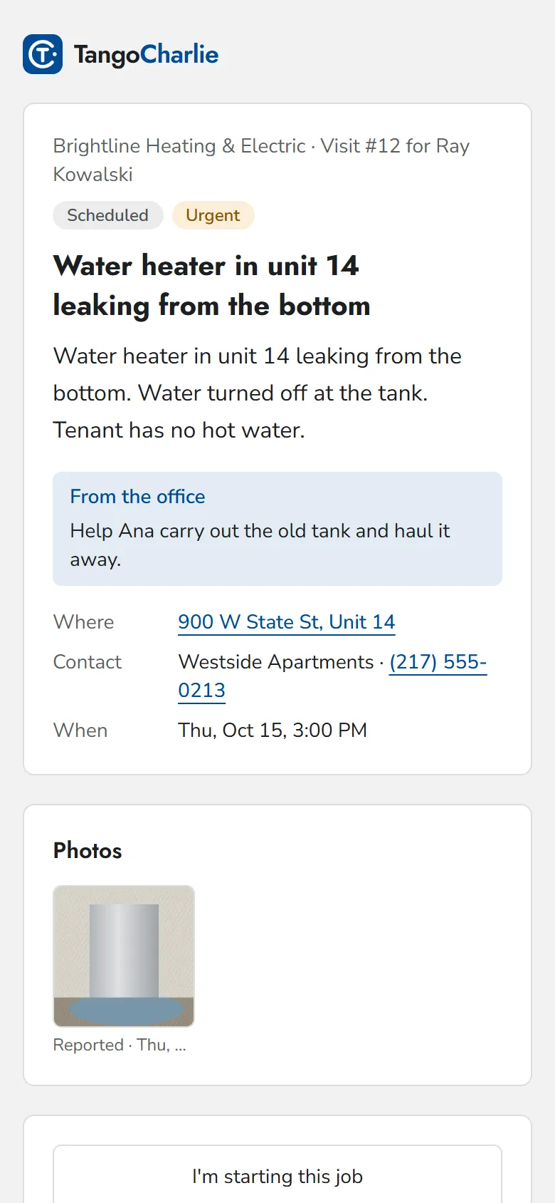 A technician's phone showing an urgent water heater visit with the address and office notes.